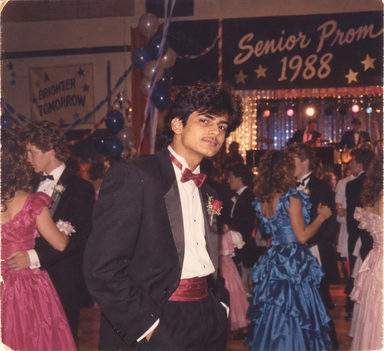 1980s American prom night photograph with formal fashion, flash photography, and vintage film grain