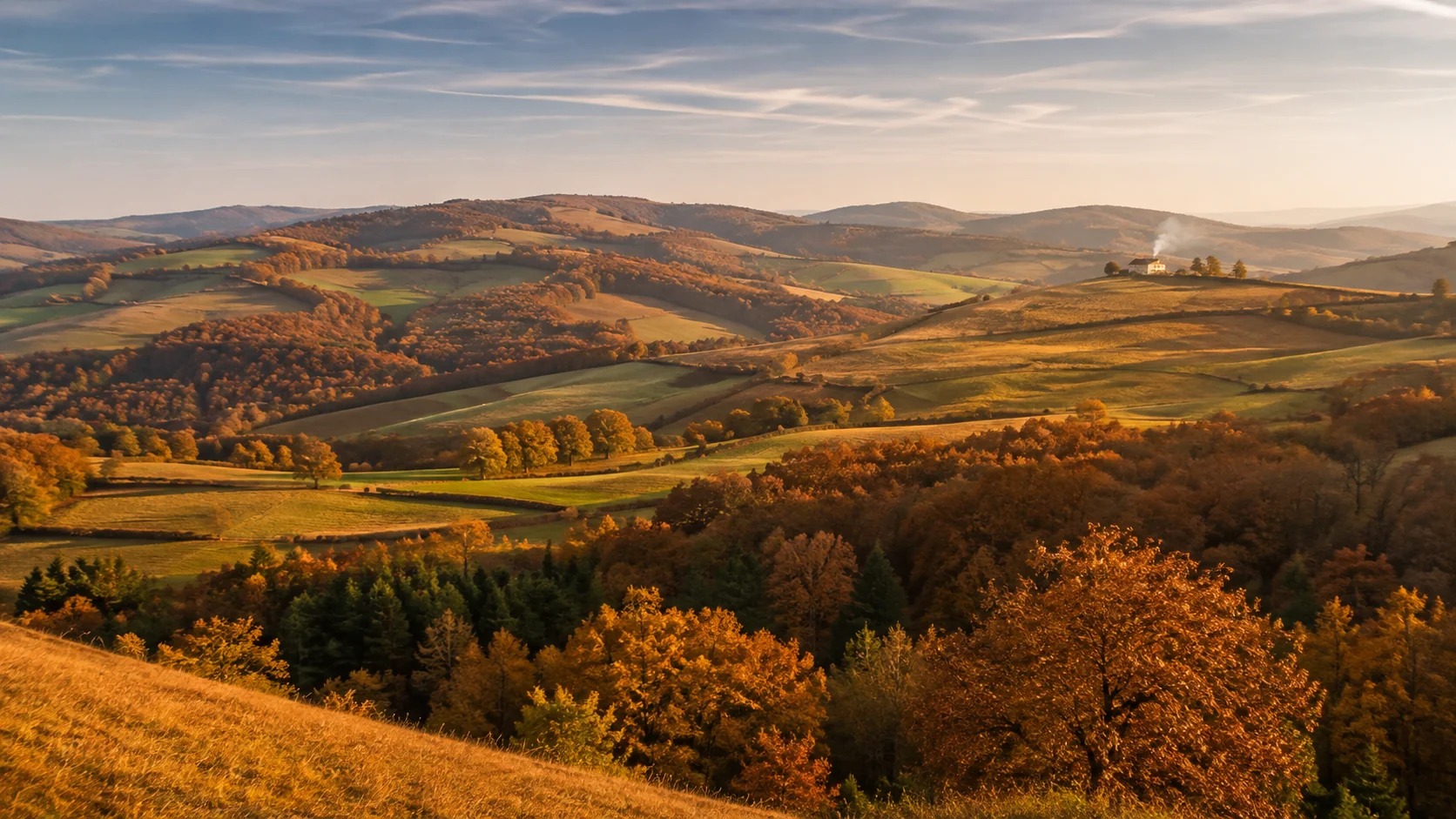 Rolling countryside hills covered in amber and gold autumn colours &mdash; fall AI image prompt