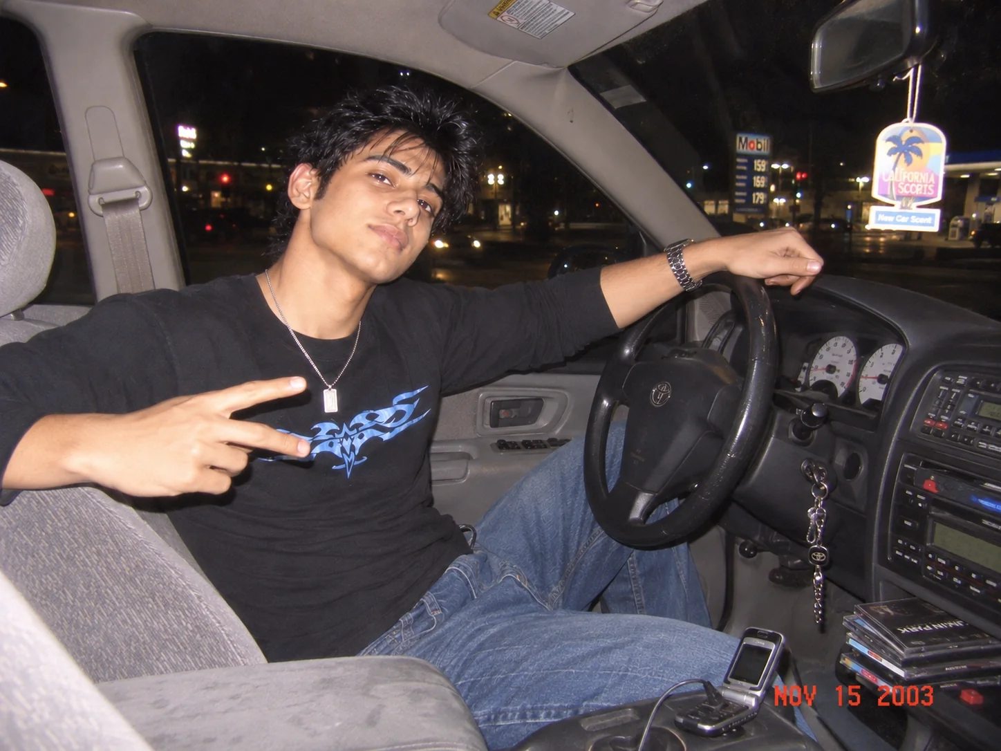 Y2K car photo with direct flash, nostalgic early 2000s styling, and compact digital camera texture