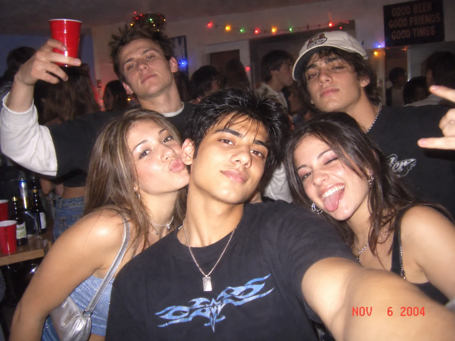 Nostalgic Y2K party snapshot with harsh flash, colorful lights, and early 2000s atmosphere